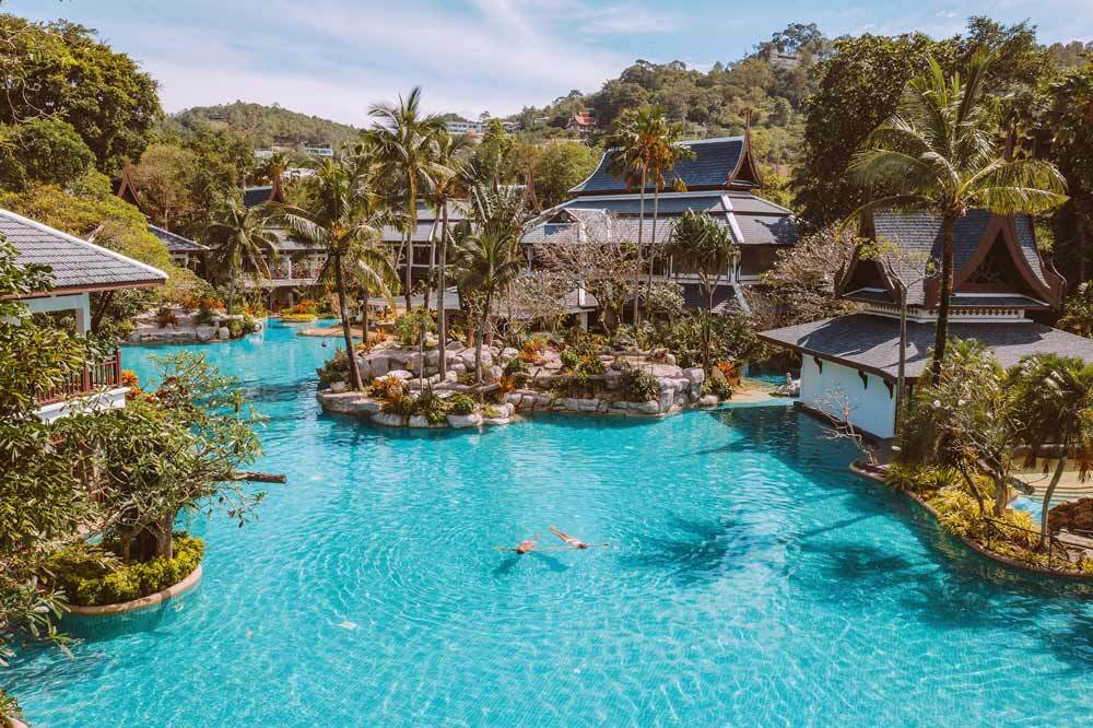 The tropical lagoon pool and Thai-style pavilions at Thavorn Beach Village